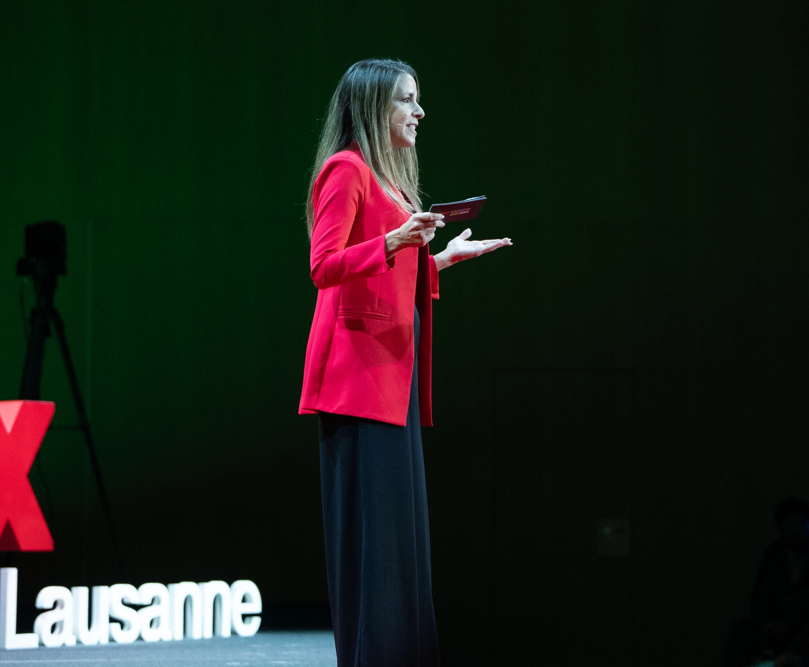 Alice speaking on stage