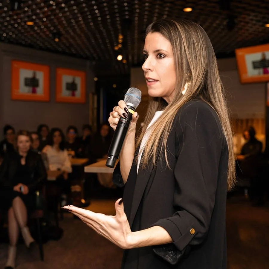 Alice speaking with a microphone